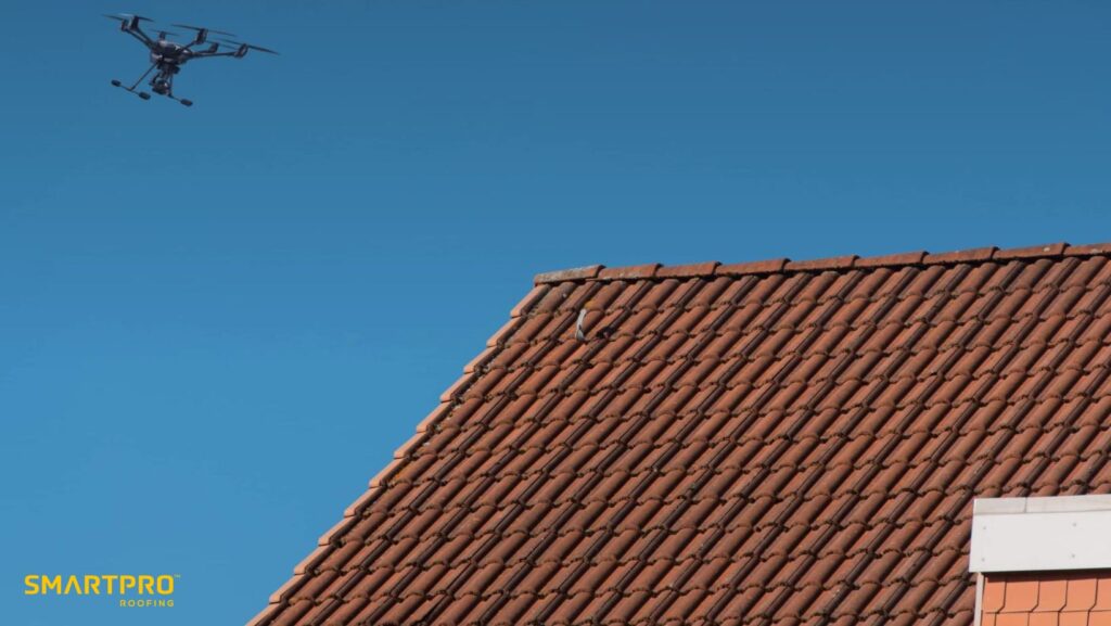 Revolutionizing Roof Repairs: A Commitment to Quality and Speed 11 A drone equipped with a camera is flying over a rooftop