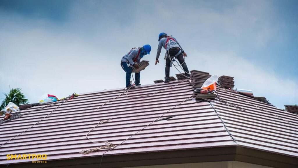 Revolutionizing Roof Repairs: A Commitment to Quality and Speed 12 Two men installing a metal roof