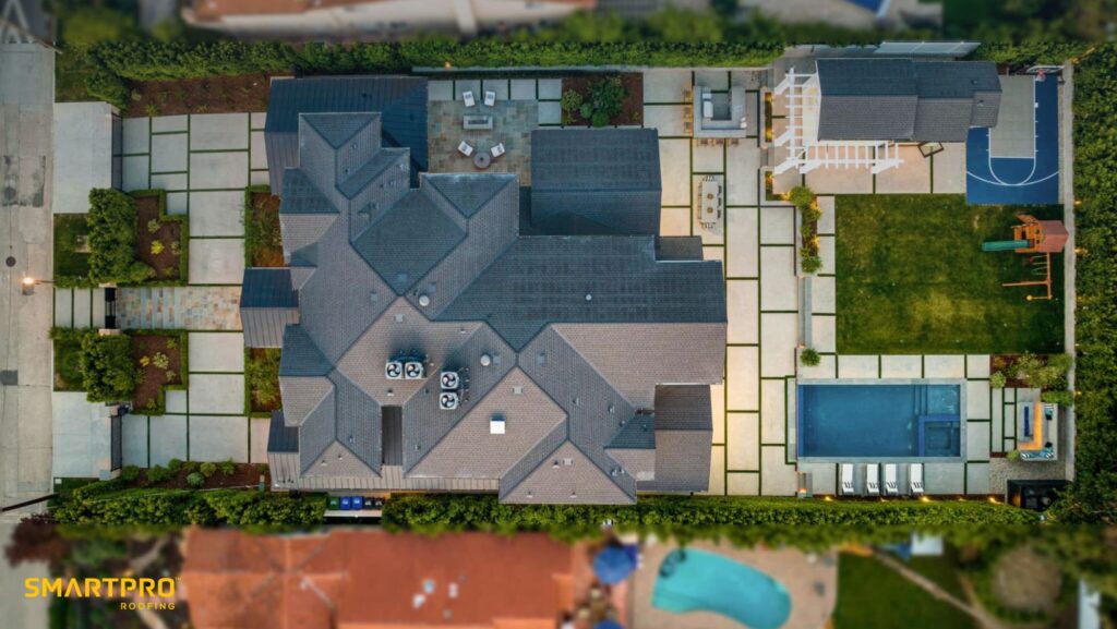 The average roof replacement cost in 2025 ranges from $5,000 to $15,000 for most U.S. homes. Smaller asphalt shingle roof projects may start around $5,000, while larger or more complex roofs, such as tile or metal roof systems can exceed $20,000. Roofing contractors typically price per square (100 square feet), with costs ranging from $350 to $1,500 per square installed. Homeowners can estimate the cost by calculating the square footage of their roof, factoring in labor cost, and using a roof replacement cost calculator.
This article breaks down the numbers, explains what factors affect the cost, and shows you how to use calculators and estimates to budget your project confidently.
What Is the Average Roof Replacement Cost in 2025?
The average roof replacement cost in 2025 ranges from $5,000 to $15,000 for standard U.S. homes. However, the overall cost depends heavily on your roof size, roof pitch, roof material, and labor cost in your area.
Asphalt shingle roof: $350–$600 per square.


Metal roof: $800–$1,600 per square.


Cedar shake roof costs: $600–$900 per square.


Tile/slate roof: $1,000–$1,800 per square.


The average price represents material and labor costs, plus roof installation cost and disposal of the old roof.
 How Much Does a Roof Replacement Cost Per Square?
Roofers often price projects per square, a roofing unit equal to 100 square feet.
A 1,500 square feet roof (about 15 squares) → $5,500–$9,000.


A 2,000 square feet roof (20 squares) → $7,500–$12,000.


A 3,000 square feet roof (30 squares) → $10,000–$18,000.


Using cost per square allows you to calculate the cost of your project more accurately than a flat estimate.
Cost by Square Foot: Breaking Down Roofing Prices
Homeowners often ask: What’s the cost per square foot to replace your roof?
Asphalt roof: $3.50–$6.00 per square foot.


Metal roof: $8.00–$16.00 per square foot.


Tile/slate: $10.00–$18.00 per square foot.


To estimate the cost, multiply the square footage of your roof by the cost per square foot of your chosen roof material.
What Factors Affect the Cost of a Roof Replacement?
Several elements can significantly affect the cost of a roof replacement:
Roof size: The larger the roof, the higher cost.


Roof pitch & complexity of your roof: Steep roofs increase installation cost.


Type of roof material: Asphalt roof is affordable, while a tile or metal roof may cost more.


Labor cost: Typically 40–60% of roof replacement expenses.


Location: The roof replacement cost in Florida is often higher due to strict codes.


Age of your roof & roof structure condition: Structural damage adds to the total cost.


Roof Replacement Cost by Material
Roof material is one of the biggest drivers of cost estimates:
Asphalt shingle roof (3-tab shingles cost): $350–$600 per square.


Metal roof: $800–$1,600 per square.


Cedar shake roof costs: $600–$900 per square.


Tile/slate: $1,000–$1,800 per square.


Your choice of roof material impacts both the installation cost and long-term repair or replacement costs. To manage the expenses, consider how to finance roof replacement projects through various financing plans available, which can help distribute the cost over time.
How Roof Size and Roof Pitch Affect Costs

The size of your roof directly determines the cost range. The larger the roof, the higher cost for labor and material.
Roof pitch: Steeper roofs require more safety equipment and labor, which adds to the cost.


Use our roof pitch calculator to find the angle of your roof. A calculator to find the pitch helps determine accurate cost estimates.


Roof Installation Costs and Labor Breakdown
Labor cost makes up 40–60% of the total cost of a roof.
Asphalt roof labor: $150–$300 per square.


Metal roof labor: $250–$500 per square.


Tile/slate labor: $400–$600 per square.


Steep roof pitch or a complex roof structure can add to the overall cost.
Using a Roof Replacement Cost Calculator Effectively
A roof replacement cost calculator is a helpful starting point.
Steps:
Measure or input the square footage of your roof.


Choose your roof type and roof material.


Factor in installation cost and labor cost.


Compare your roof replacement estimate with actual quotes.


Remember: Calculators give cost estimates, but only a roofing contractor can confirm the actual cost.
How to Tell If You Need a Roof Replacement or Repair
You may need a roof replacement if:
The age of your roof exceeds 20 years.


The current roof shows major leaks.


Shingles cost damage: missing, curling, or cracked.


An inspection suggests replacement is necessary instead of repair.


A professional can inspect your roof and decide if a full roof replacement is required.
Why a New Roof Is a Significant Investment
A new roof is a significant investment, not just an expense. A new roof may:
Protect your home from costly water damage.


Boost property value and energy efficiency.


Reduce repair or replacement costs long-term.


A roof is one of the most essential parts of your home, and a new roof is a significant investment in its future.
How SmartPRO Roofing Delivers Accurate Cost Estimates
The cost of replacing a roof depends on factors like your roof’s size, pitch, material, and labor. Online calculators only give estimates, but SmartPRO Roofing provides exact pricing in under an hour with our SmartQoute Tool, powered by advanced satellite imagery.
You’ll see a clear cost breakdown before work begins, no guesswork, no hidden fees. Paired with precision installation and premium materials, your new roof is built to deliver long-term value and protection.
Plan your project with certainty. Get your exact Roof Quote now with SmartQuote.
FAQs: Roof Replacement Cost in 2025
How much does a roof replacement cost on average?
The average cost to replace a roof in 2025 is $5,000–$15,000, depending on size, material, and labor.
What’s the average price per square for asphalt shingles?
The average price per square is $350–$600 for asphalt shingles.
Can I get a roof replacement estimate online?
Yes, a cost calculator provides a quick roof replacement estimate, but only a roofing contractor can confirm the actual cost.
What’s the cost of a new roof in Florida?
A new roof cost in Florida ranges from $7,000–$25,000, depending on material and roof size.
Is a new roof a significant investment?
Yes, a new roof is a significant investment that protects your home and increases value.