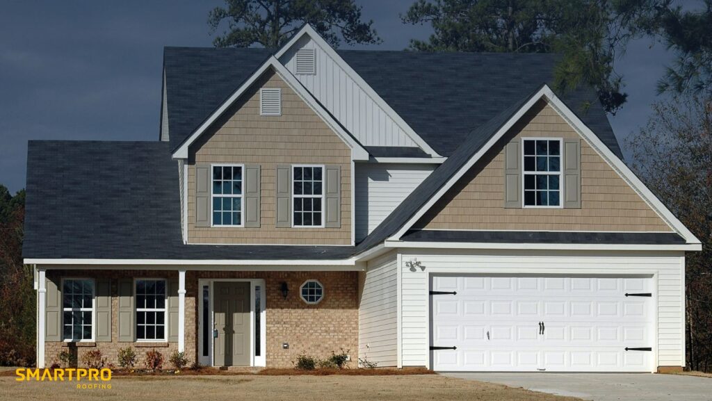 Two-story home featuring a garage and a driveway