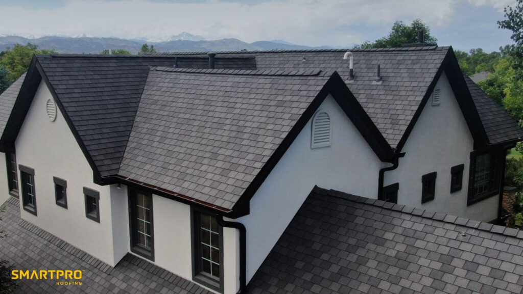 A roof featuring black shingles complemented by white trim