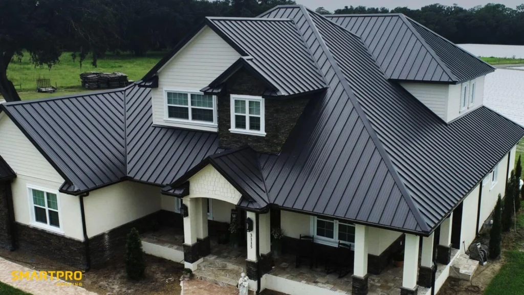 A house with a sleek metal roof set in a large
