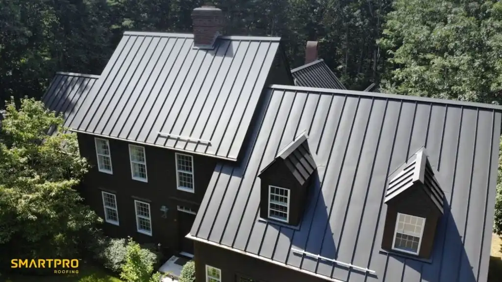 A house featuring a metal roof and several windows