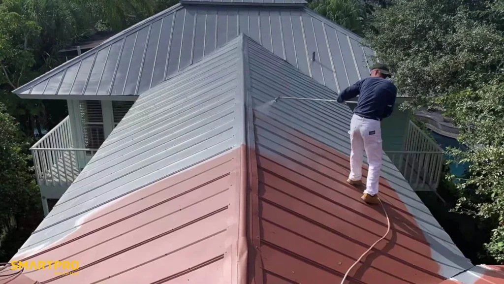 How Metal Roof Coatings Extend Lifespan in Florida Weather 10 A man using a sprayer to paint a roof