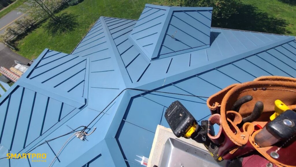 Metal Roof Cost: How Smart Quotes Deliver Transparent Pricing for Premium Roofs 11 A man is climbing a ladder to work on a roof