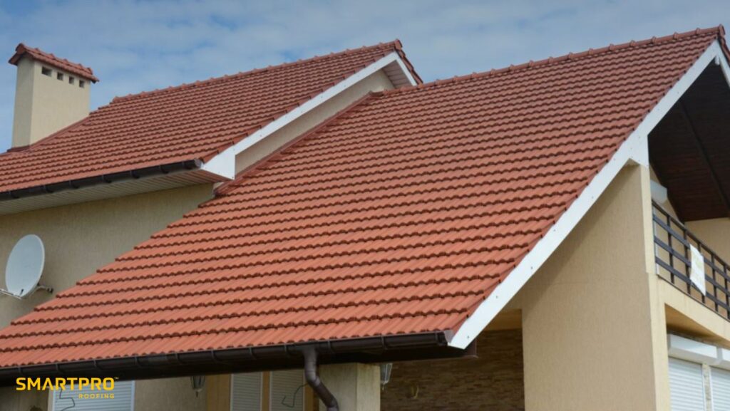Metal Roof ROI: Clay vs. Concrete Tiles: Which Lasts Longer in Florida Homes? 10 A house featuring a red roof and a white chimney against a clear sky.