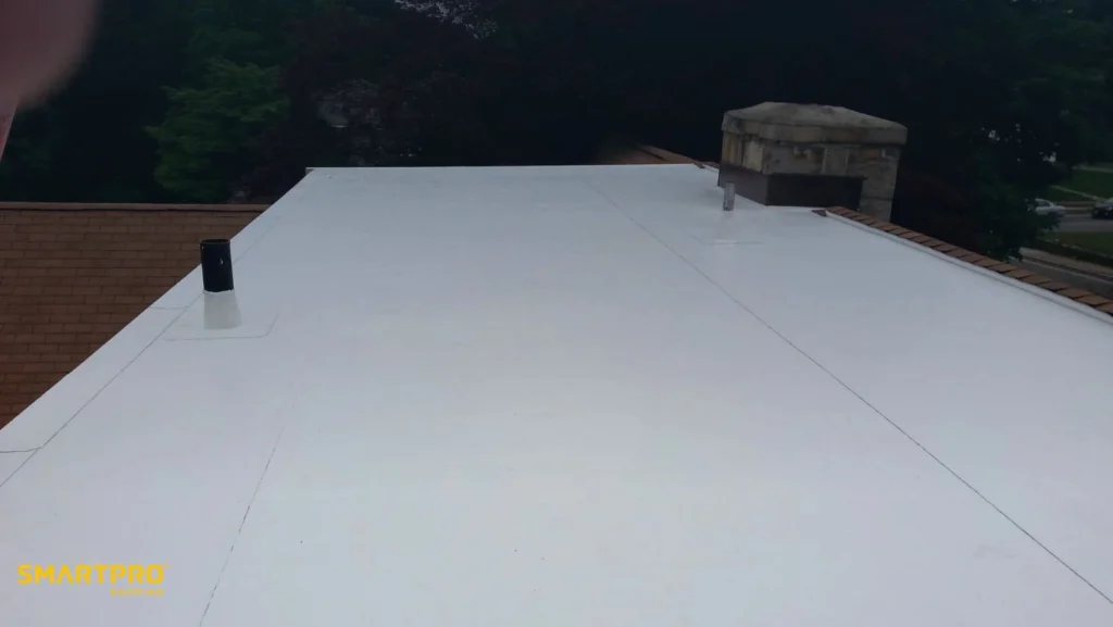 A roof featuring a white metal roofing, showcasing a clean and modern design.